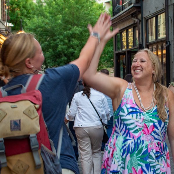 a group of people standing in front of a building