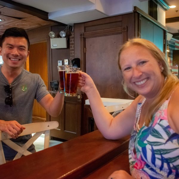 a man and a woman standing in a kitchen