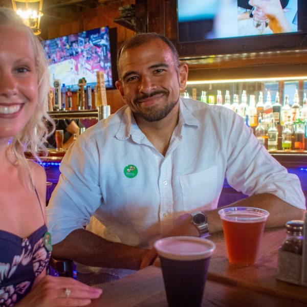 a woman sitting at a table posing for the camera
